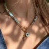 Collier perles heishi en jaspe, breloques œil et corail Atelier CVL